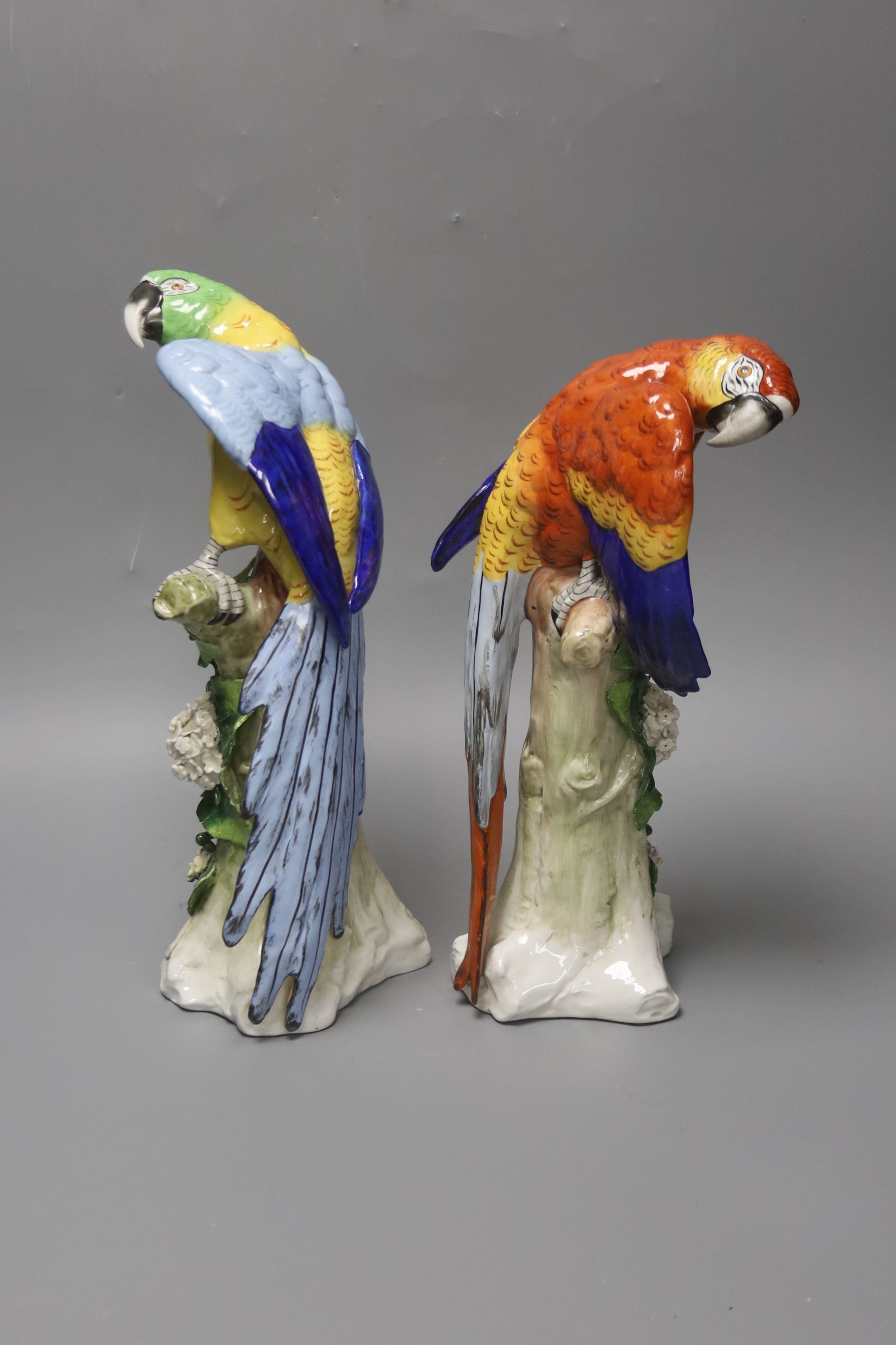 A pair of Sitzendorf porcelain models of parrots 32cm